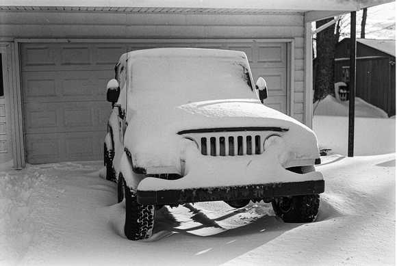 Jeep in driveway ovenight snow zilla